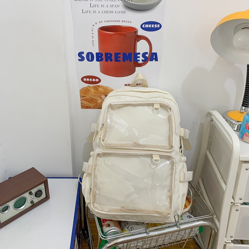 Cream transparent panel backpack on metal cart, retro radio and poster backdrop