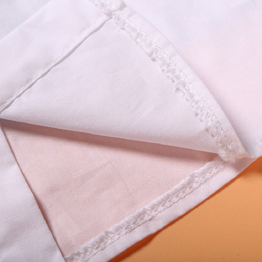 Soft white cotton fabric with delicate stitching, ideal for premium fashion apparel