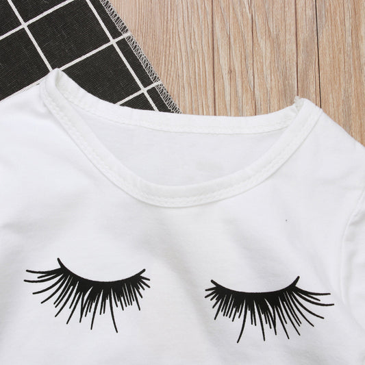 White kids t-shirt with black eyelash print, cute fashion top for children