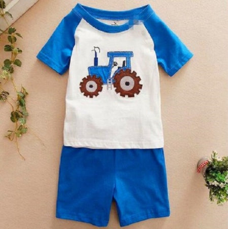 Young boy wearing Ancient Energy children's summer suit, stylish boys' clothing for warm weather, casual and comfortable kids' outfit.