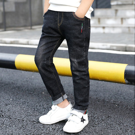 Boys' denim trousers by Ancient Energy featuring a new style, suitable for spring and autumn, shown on a child.
