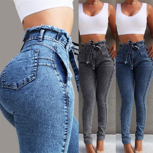 Ancient Energy fringed jeans with distressed details and frayed hems, showcasing casual fashion style.