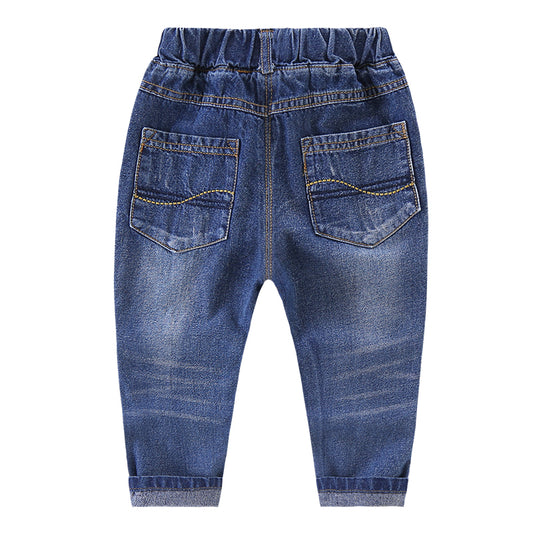Ripped children's jeans by Ancient Energy showing distressed denim with ripped details and a casual fit.