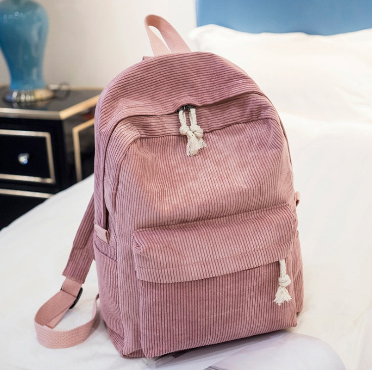 Ancient Energy corduroy backpack for students with shoulder straps, ideal for school and casual use, in a stylish design.