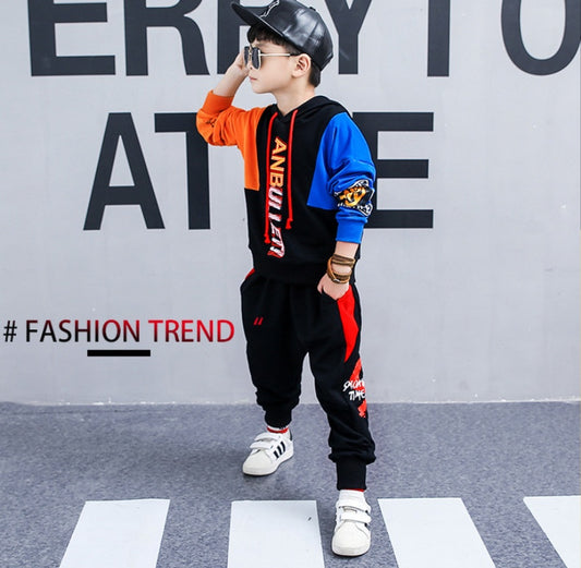 Boy wearing a spring Korean children's long-sleeved sports suit by Ancient Energy, featuring a comfortable two-piece outfit for spring.