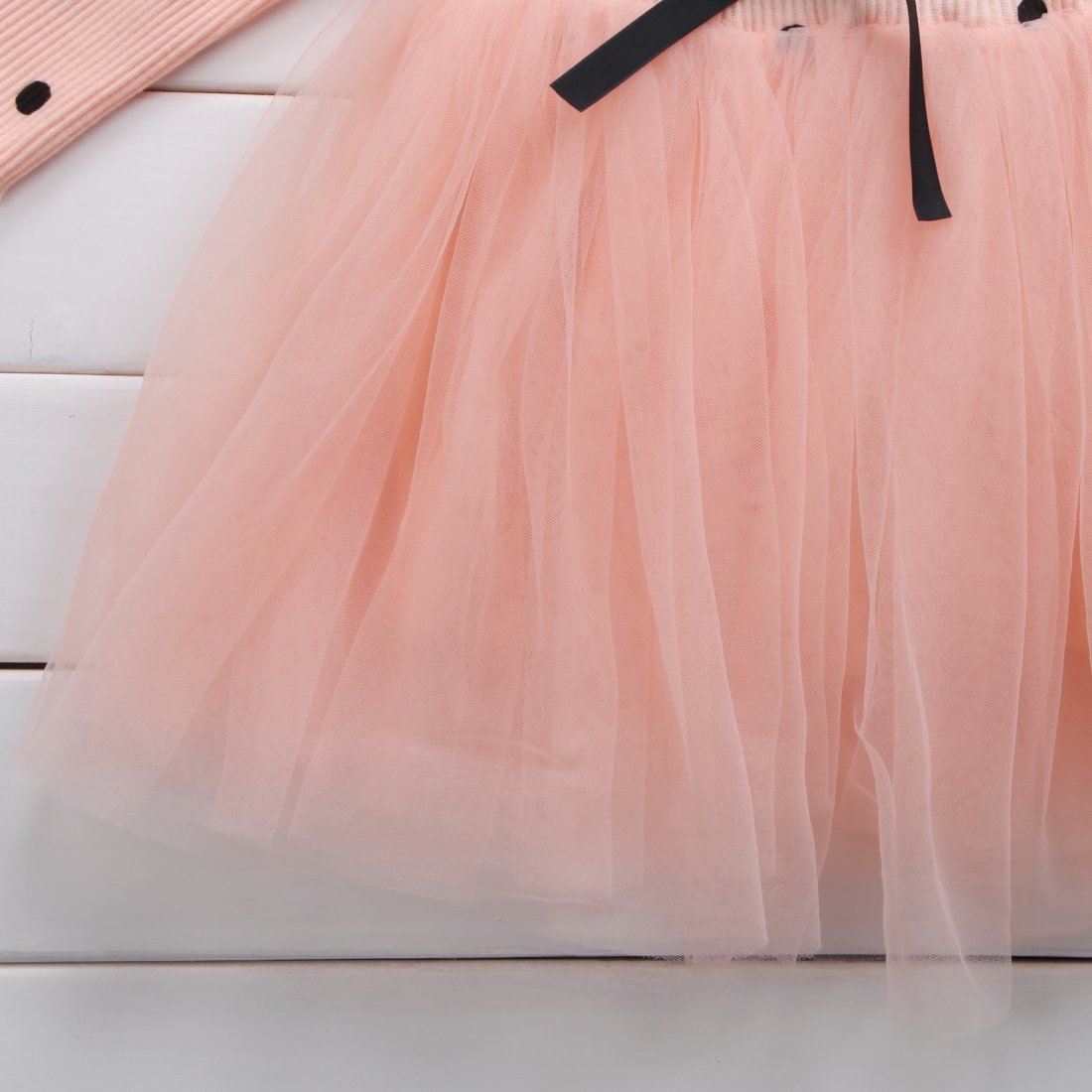 Baby girl wearing a long-sleeve lace tutu dress from Ancient Energy, suitable for spring, winter, birthdays, and christenings.