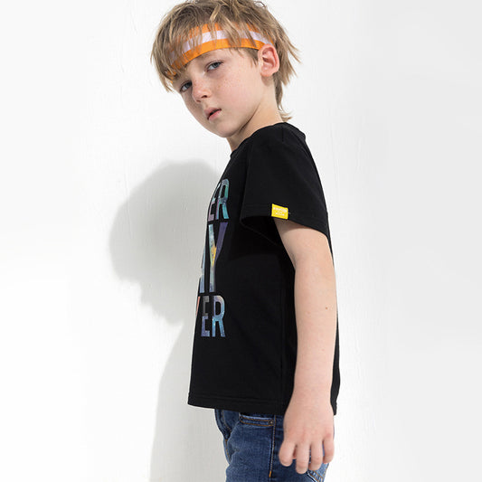 Children's letter print T-shirt by Ancient Energy, featuring colorful alphabet letters on a soft fabric background.
