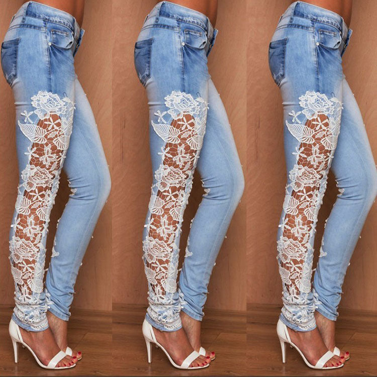 Light blue lace jeans from Ancient Energy with intricate lace detailing and slim fit design.