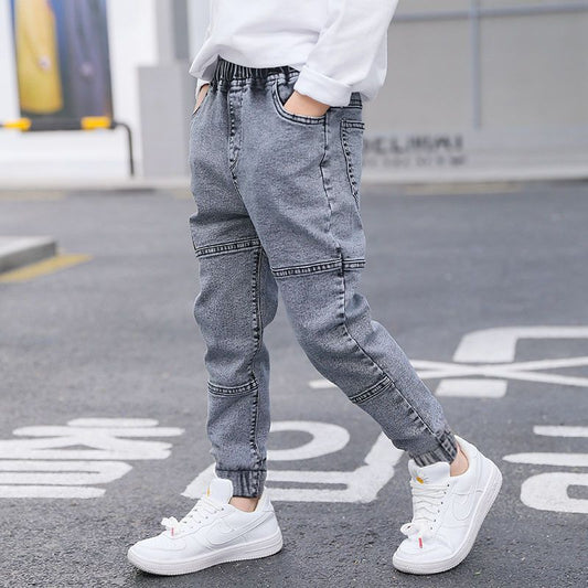 Boys' spring and autumn jeans from Ancient Energy featuring classic denim style and adjustable waist for a comfortable fit.
