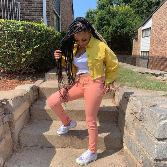 Women’s denim jacket by Ancient Energy featuring a casual, cropped streetwear style with fitted bodycon design and outwear features.