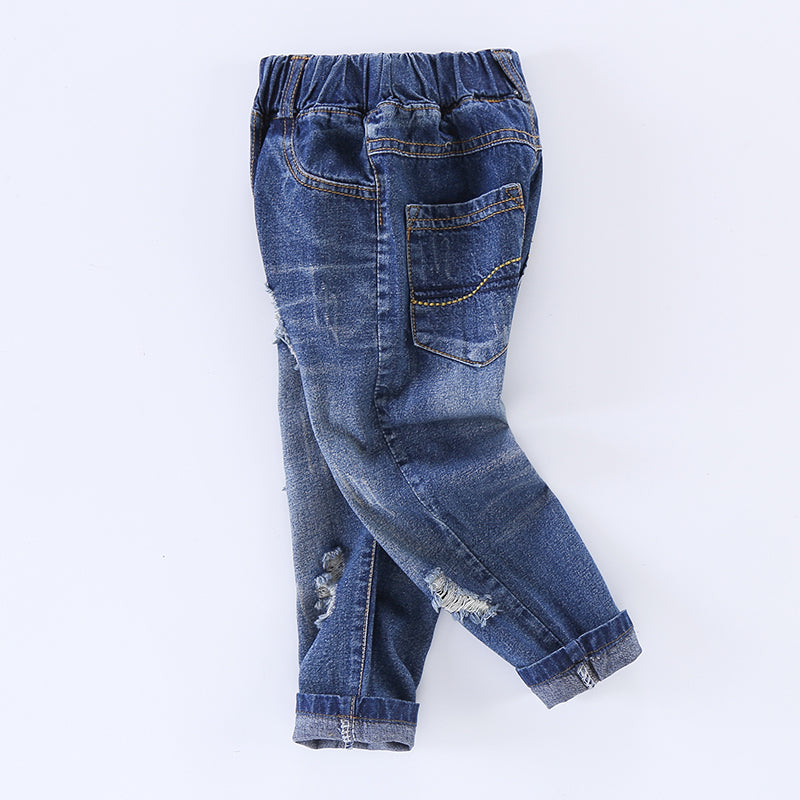 Children's ripped jeans from Ancient Energy featuring distressed details and a casual fit, ideal for everyday wear.
