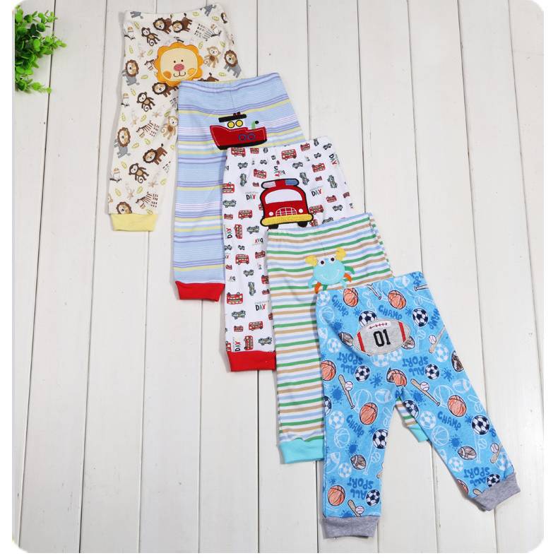 Set of five children's leggings with colorful cartoon print from Ancient Energy, featuring playful patterns and soft fabric.
