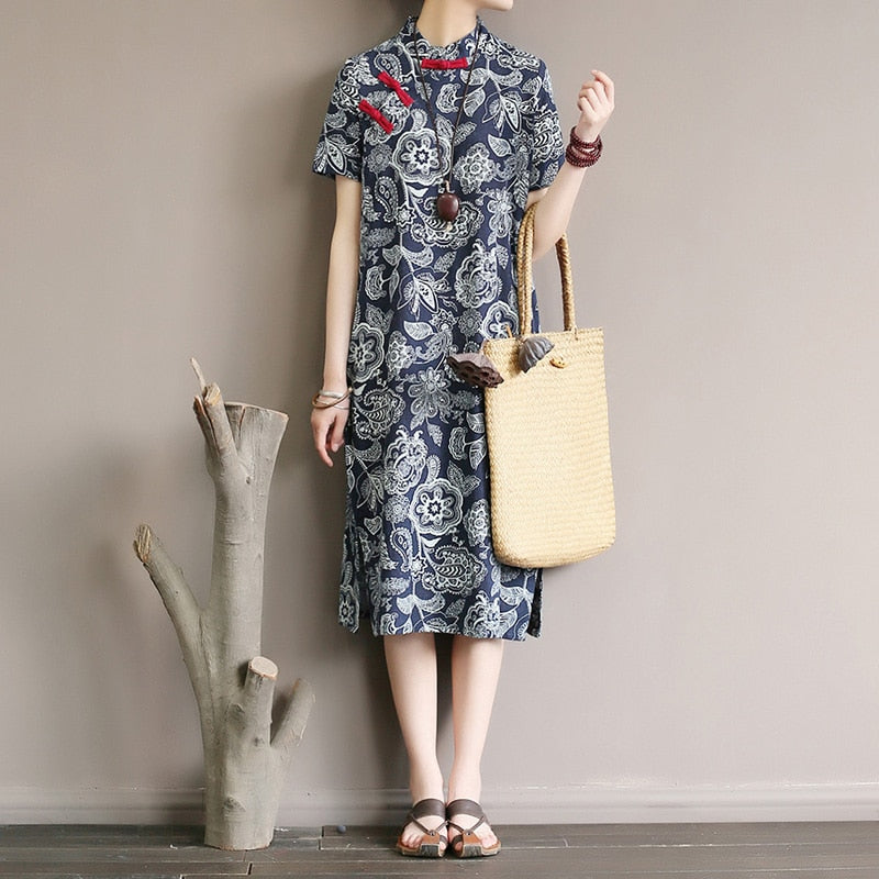 Mandotos International retro floral cotton dress with side slit, featuring a vibrant floral pattern and classic fit.