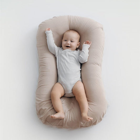 Ancient Energy baby nest bed and crib for newborns, portable cotton infant cradle with soft cushion for travel and cozy sleeping.