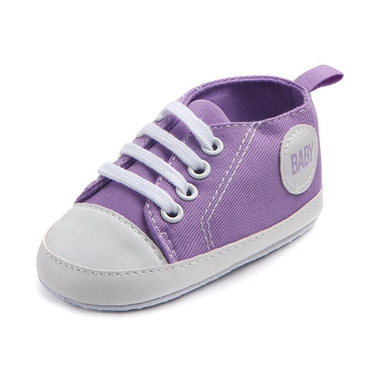 Ancient Energy baby boys and girls canvas sports sneakers with soft soles and anti-slip design for first walkers and toddlers.
