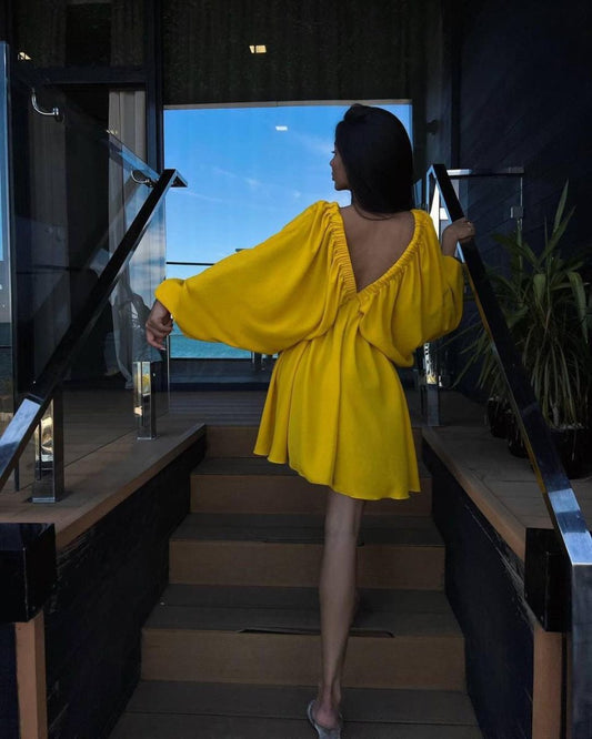 Elegant women's V-neck lantern sleeve dress by Ancient Energy, featuring stylish sleeves and a flattering fit.