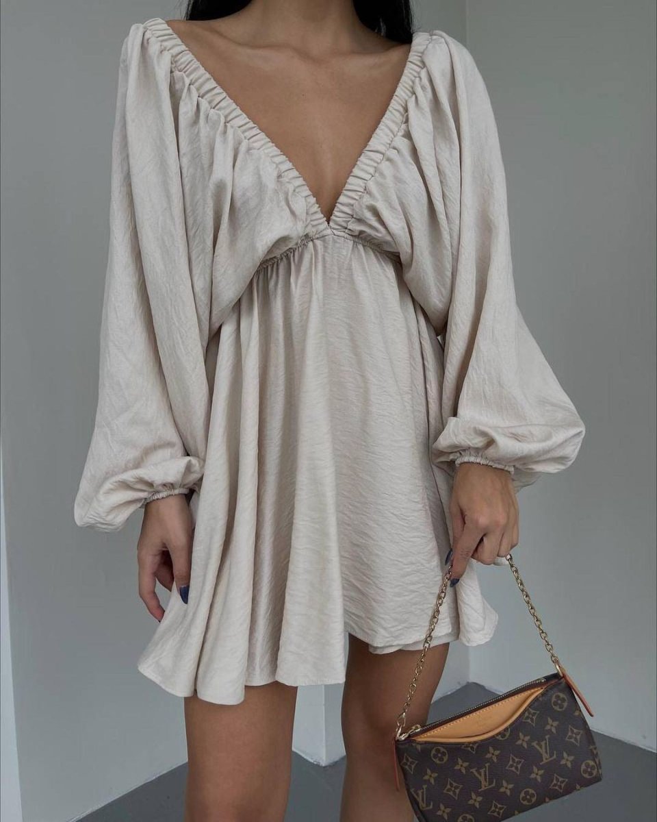 Elegant women's V-neck lantern sleeve dress by Ancient Energy, featuring a stylish fit and flowy fabric for a fashionable look.
