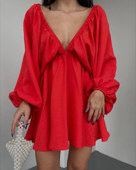 Elegant women’s V-neck lantern sleeve dress by Ancient Energy, featuring a fashionable design and flowing fabric.