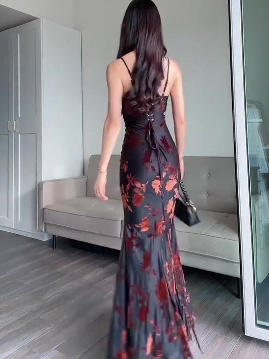 Ancient Energy flocked strappy maxi dress in black, featuring a fitted bodice and flowing skirt, perfect for elegant occasions.