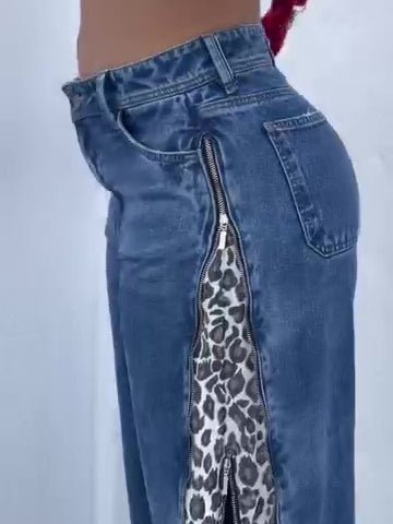 Leopard print zip-up jeans from Ancient Energy featuring a stylish animal pattern and classic denim fit.