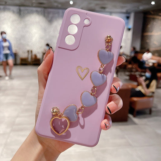 Ancient Energy Love Chain phone case with bronzing hollow design, drop-resistant construction for iPhone or smartphone protection.