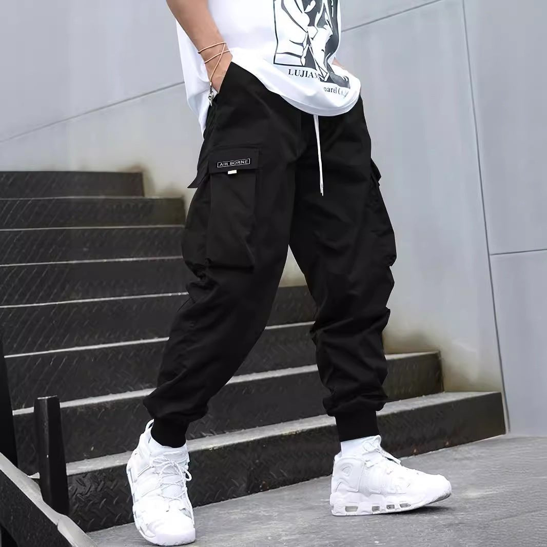 Ancient Energy men's multi-pocket cargo pants with drawstring waist, casual hip-hop style, suitable for outdoor streetwear and sports.