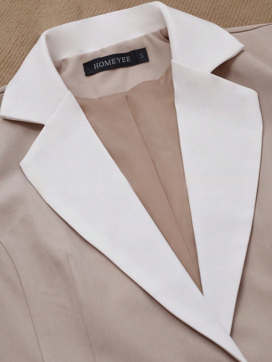 Elegant formal blazer by Ancient Energy featuring contrasting color buttons and tailored fit, suitable for professional or dressy occasions.
