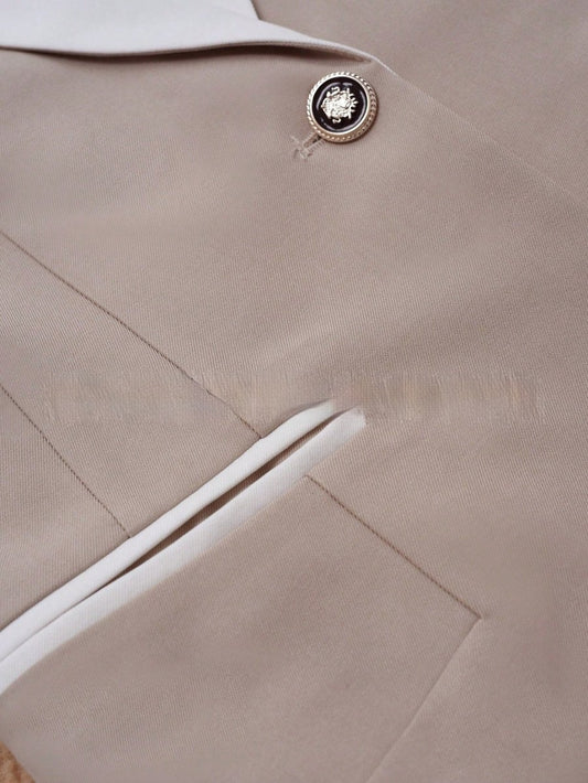 Elegant formal blazer by Ancient Energy featuring contrasting color buttons and tailored design, ideal for professional attire.