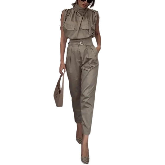 Ancient Energy shoulder slimming waist belt worn over a blouse and pants, enhancing silhouette with stylish decoration.