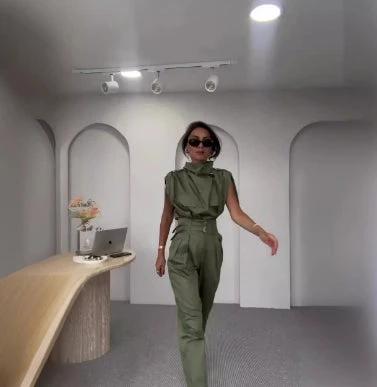 Ancient Energy shoulder slimming waist belt with decorative blouse and pants, showcasing a stylish and slimming fashion look.