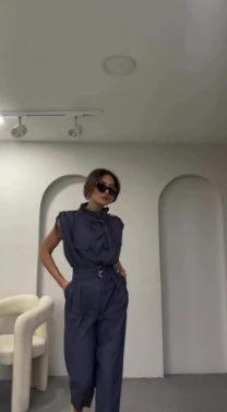 Ancient Energy shoulder slimming waist belt with decorative blouse and pants, showcasing a stylish, fitted outfit.