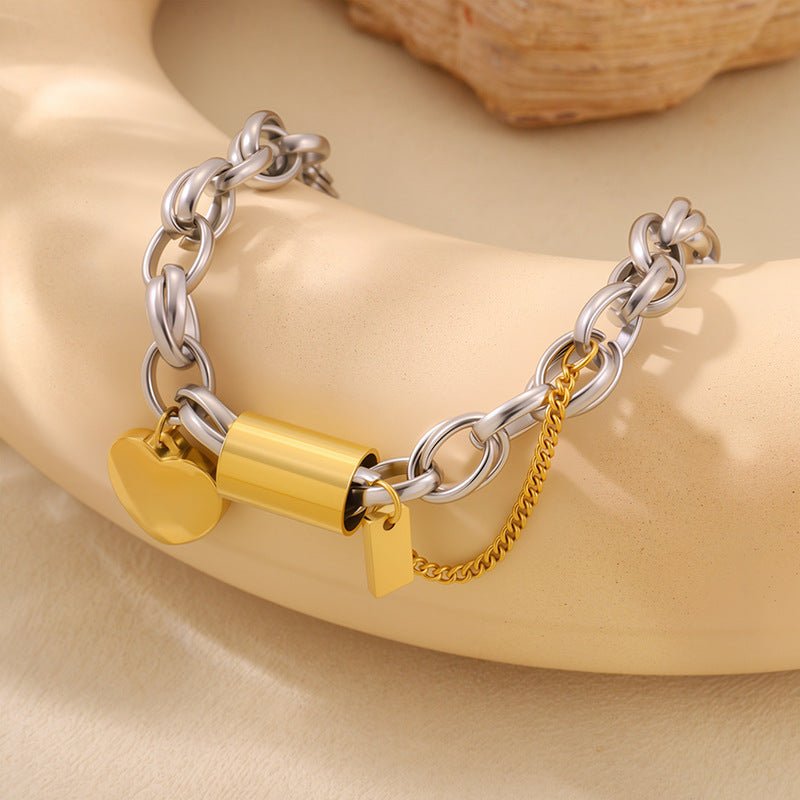 Ancient Energy titanium bracelet featuring a heart-shaped pendant, showcasing a sleek and versatile jewelry design.