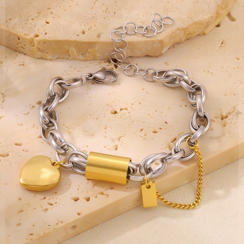 Ancient Energy titanium bracelet featuring a heart-shaped pendant, showcasing a sleek and versatile design in close-up view.