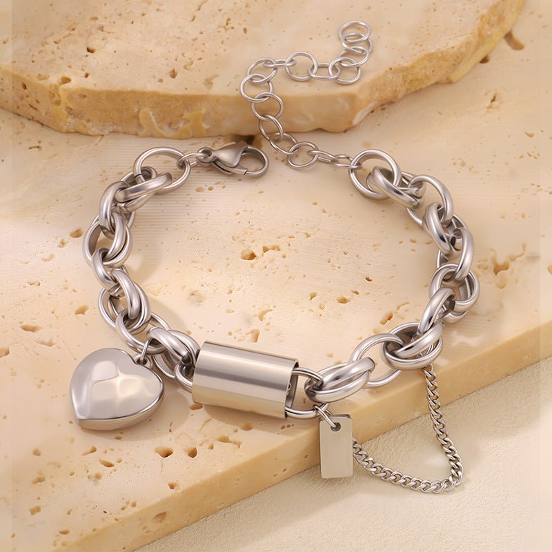 Titanium bracelet by Ancient Energy featuring a heart-shaped pendant, stylish and versatile jewelry accessory.