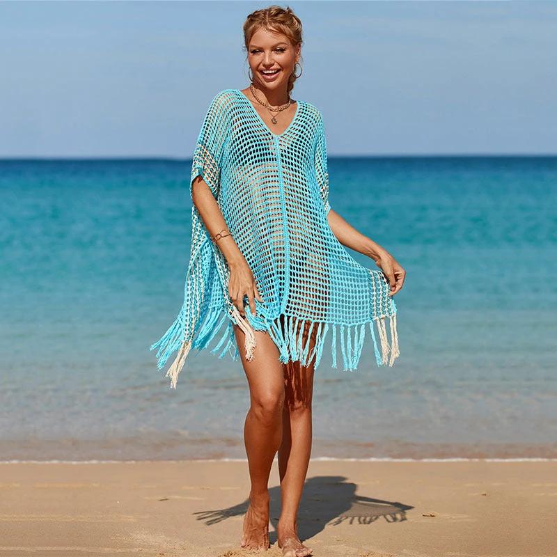 Women's knitted colorful striped beach blouse by Ancient Energy, featuring vibrant patterns and a relaxed fit for seaside style.