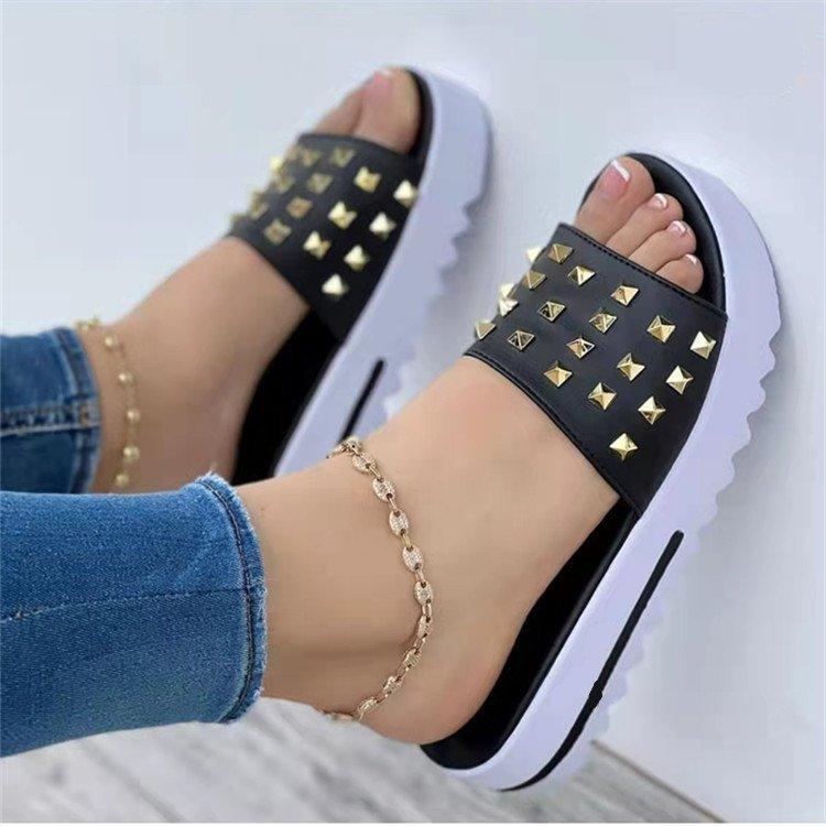 Women's wedge and rivet beach flip-flops by Ancient Energy featuring a comfortable wedge heel and stylish rivet details.