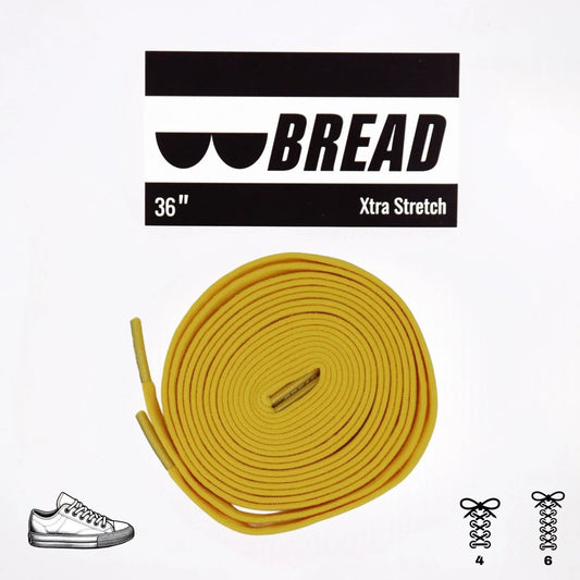 Elastic shoelace in vibrant yellow from Bread, designed for easy slip-on comfort and secure fit.