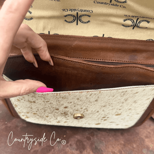Grace Tooled Leather Purse by Countryside Co. featuring intricate tooling, a compact design, and a stylish leather finish.