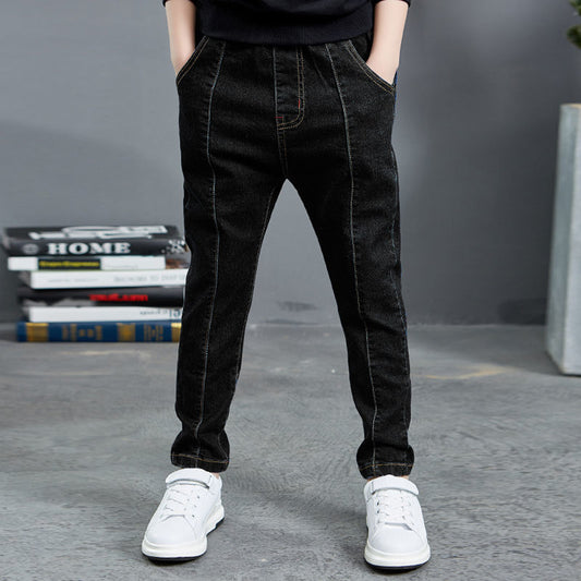 Boy wearing navy velvet one-piece jeans for autumn and winter by Ancient Energy, featuring a comfortable, stylish design.