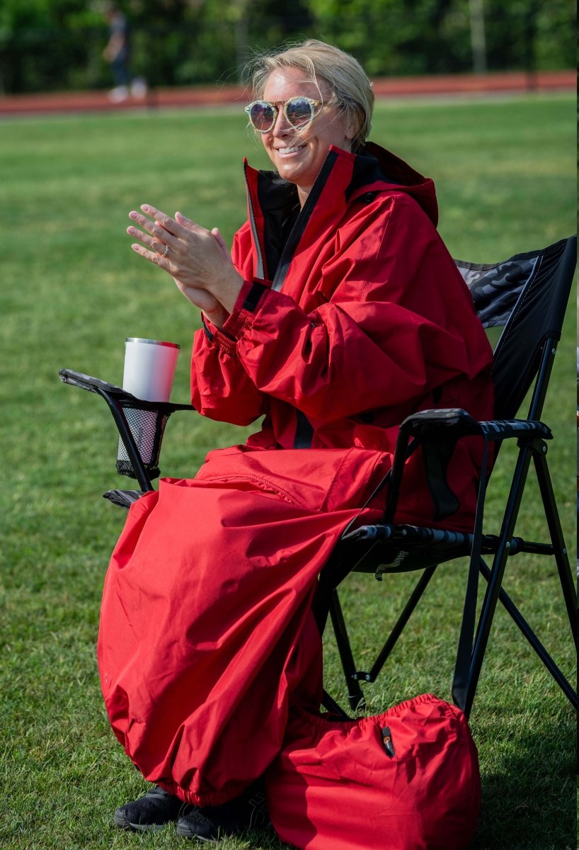 IWOM WeatherShield Convertible Jacket shown on model, featuring adjustable hood, multiple pockets, and waterproof fabric for versatile protection.