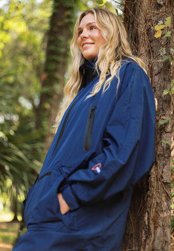 IWOM WeatherShield Convertible Jacket shown in black, featuring a hood, zip front, and adjustable cuffs for versatile weather protection.