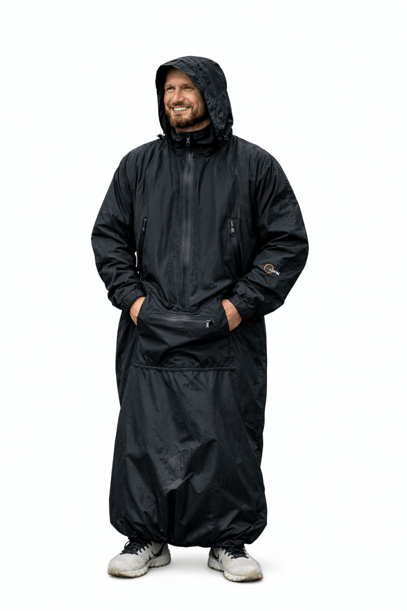 IWOM WeatherShield Convertible Jacket shown in black, featuring a hood, multiple pockets, and adjustable cuffs for versatile outdoor wear.