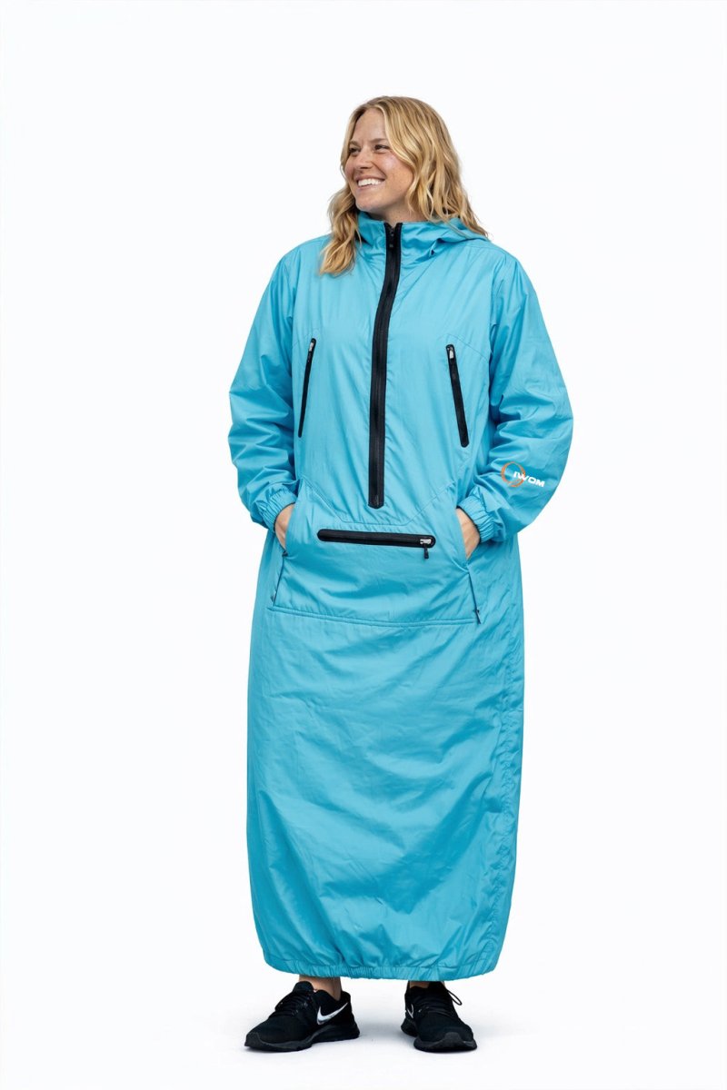 IWOM WeatherShield Convertible Jacket shown in black, featuring a hood, zipper front, and adjustable cuffs for versatile weather protection.