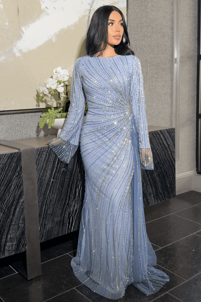 Iyza Belaar Abira sequin modest neckline long sleeve dress with embellished details and side skirt, elegant evening wear.