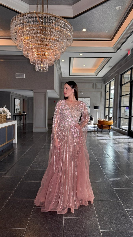 Elegant Inaya long drape sleeves beaded A-line gown by Iyza Belaar, featuring intricate beadwork and flowing fabric.