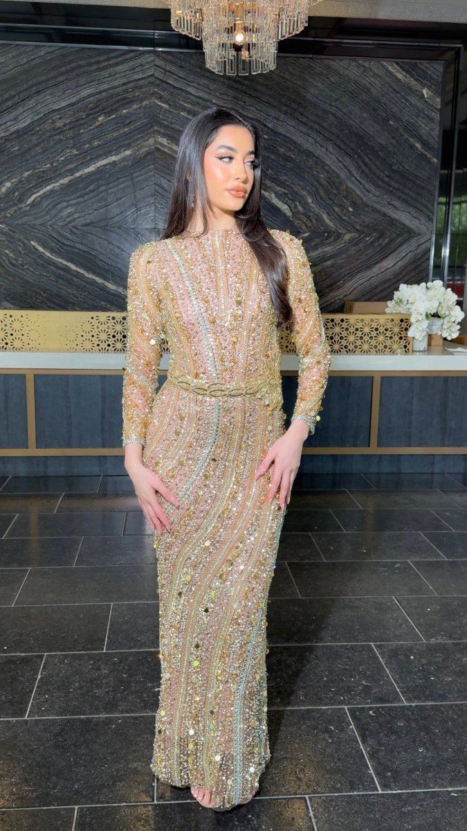 Iyza Belaar Mariam long sleeve beaded dress, elegant evening dress with intricate bead detailing and flowing fabric.