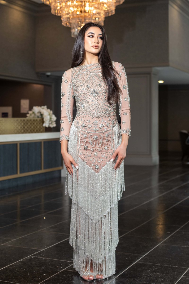 Iyza Belaar Dalia long sleeve beaded sequin modest tassel gown, elegant long dress with intricate beadwork and flowing silhouette.