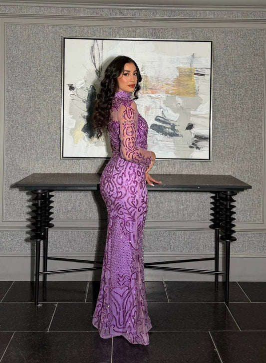 Iyza Belaar Deema long dress with high neckline and tulle fabric featuring intricate embroidery, elegant evening wear.