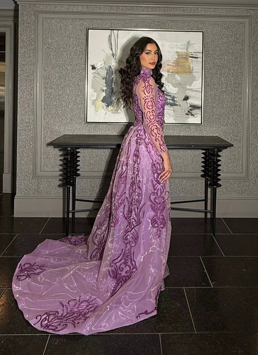 Iyza Belaar Deema long dress with high neckline, tulle fabric, and intricate embroidery, showcased in this elegant evening gown.
