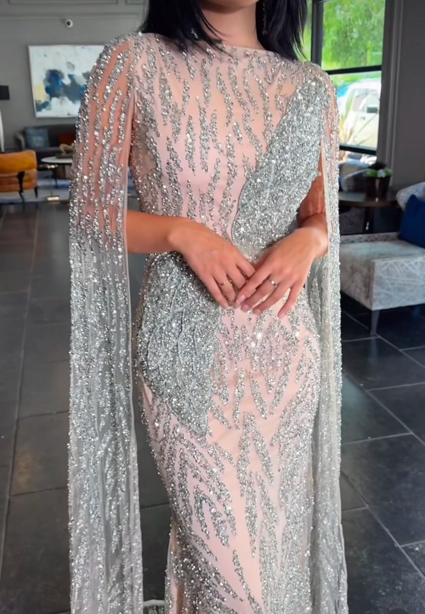 Iyza Belaar Nabilah embellished cape sleeve long dress with intricate details and elegant design, perfect for formal occasions.
